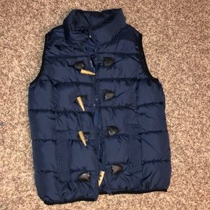 Woman’s navy blue vest.